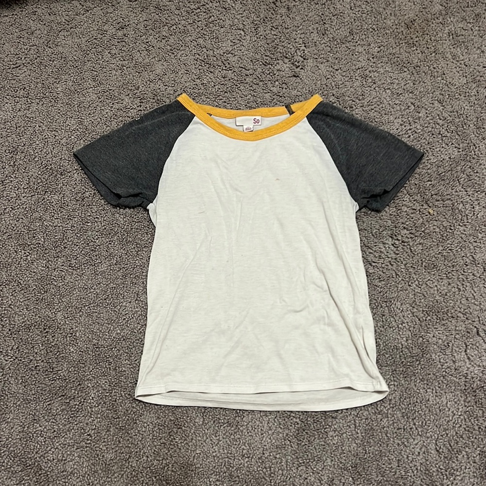 T shirt with grey sleeves and a mustard yellow collar color